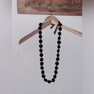 Made and bought in HI. Natural polished macadamia nut necklace